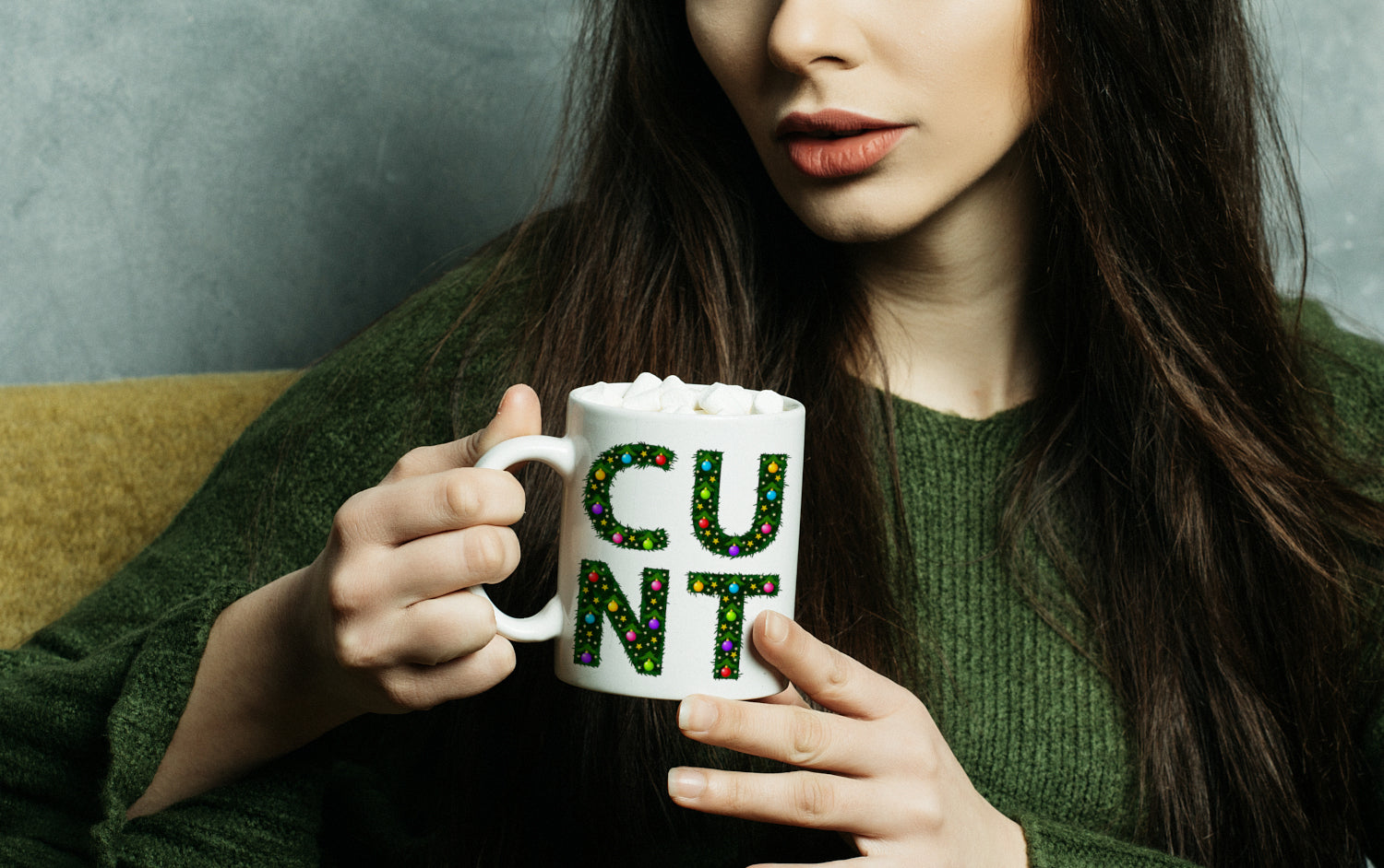 C U N T Christmas - Mug being held by woman in green jumper - Banner