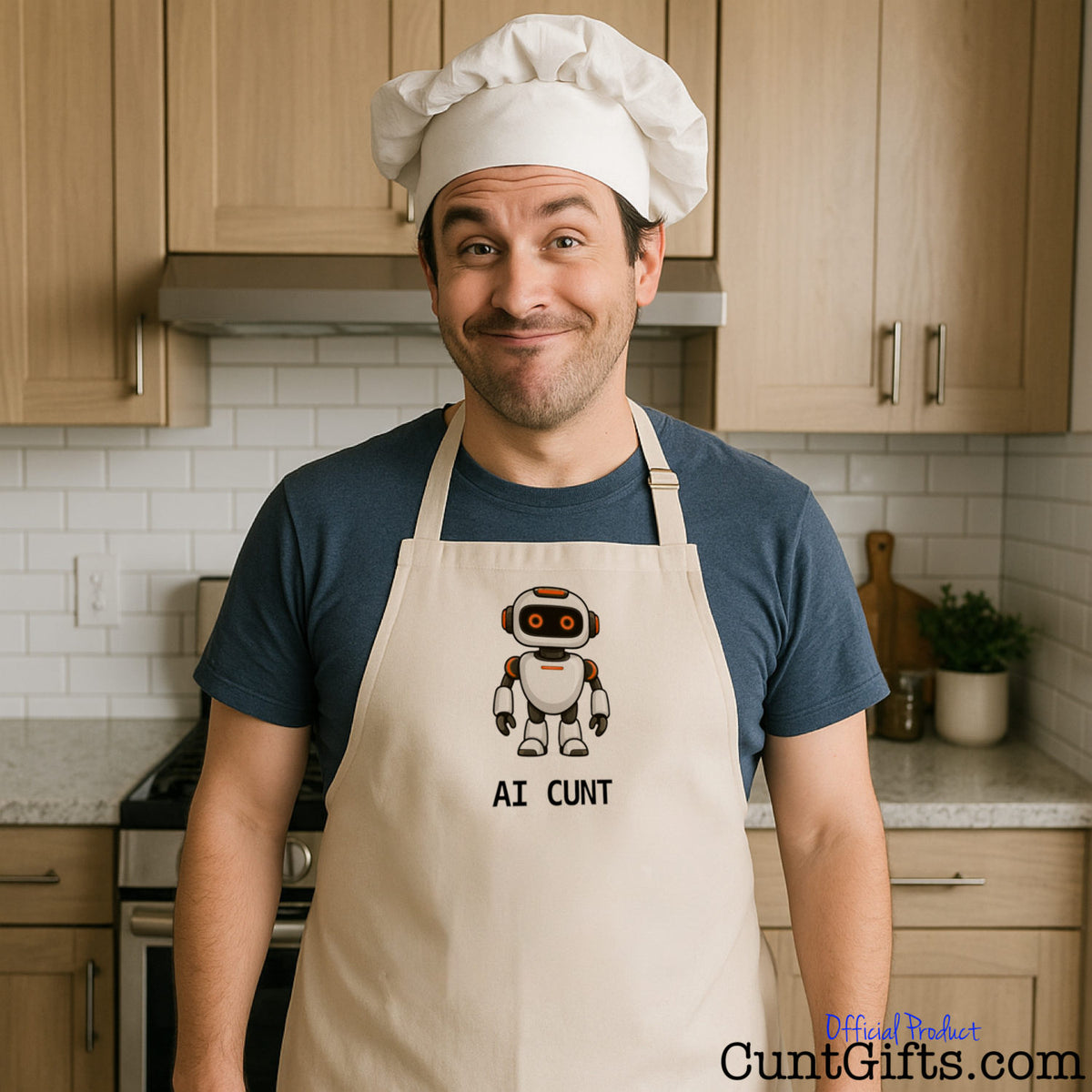 Smiling man wearing a chef's hat and a beige AI Cunt novelty apron with a funny robot design in a kitchen.