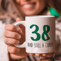 ANY AGE and Still a Cunt - Mug held by woman smiling