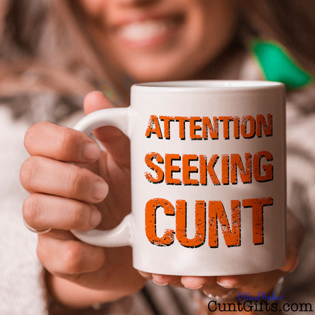 Attention Seeking Cunt Mug Held by smiling woman