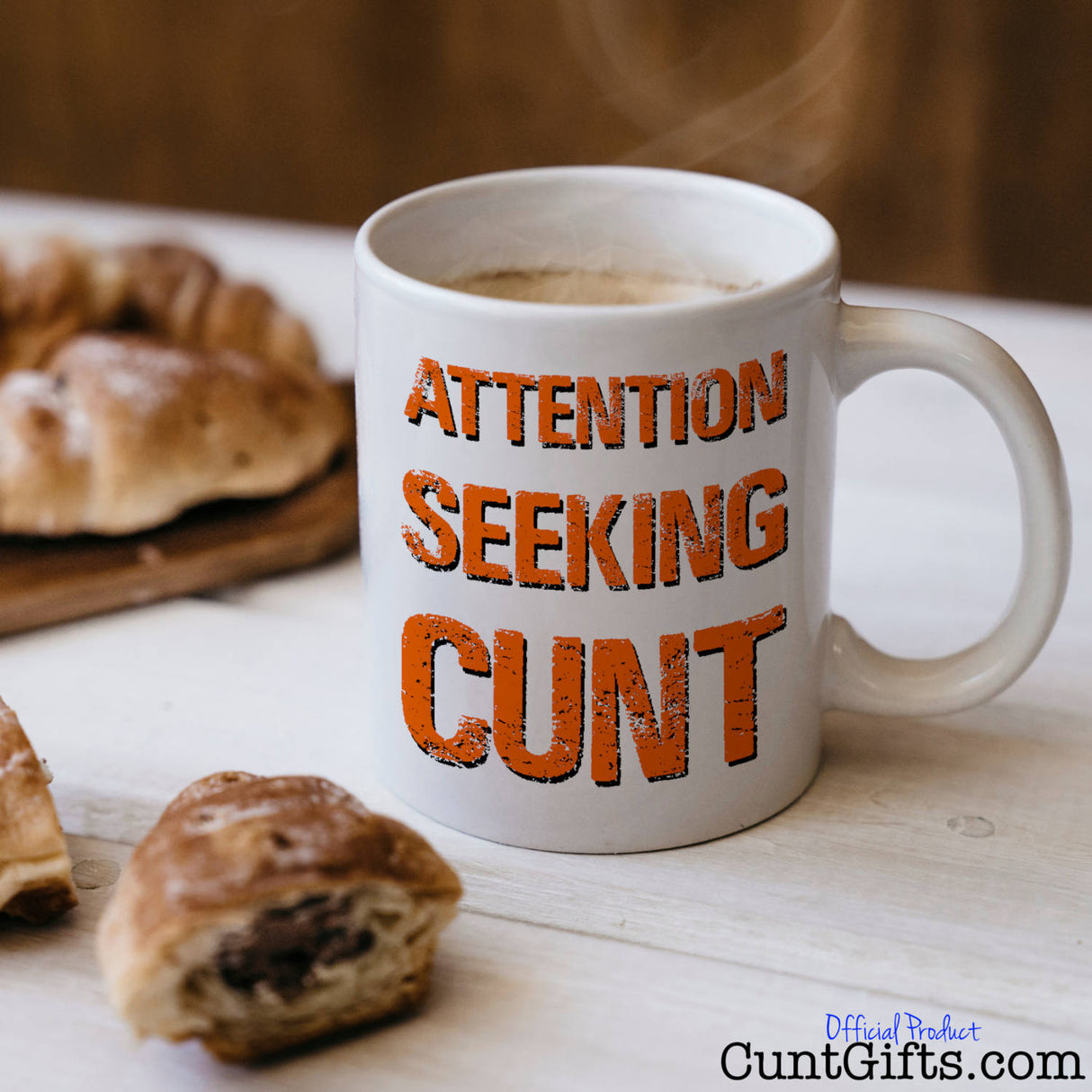Attention Seeking Cunt Mug with coffee and pastries