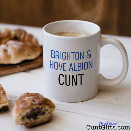 Brighton & Hove Albion Cunt Mug with coffee and croissants