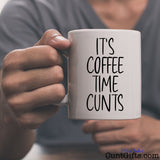 It's Coffee Time Cunts - Mug held by man in grey v neck t-shirt