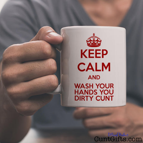 Keep Calm & Wash Your Hands You Dirty Cunt - Mug held by man in grey t-shirt