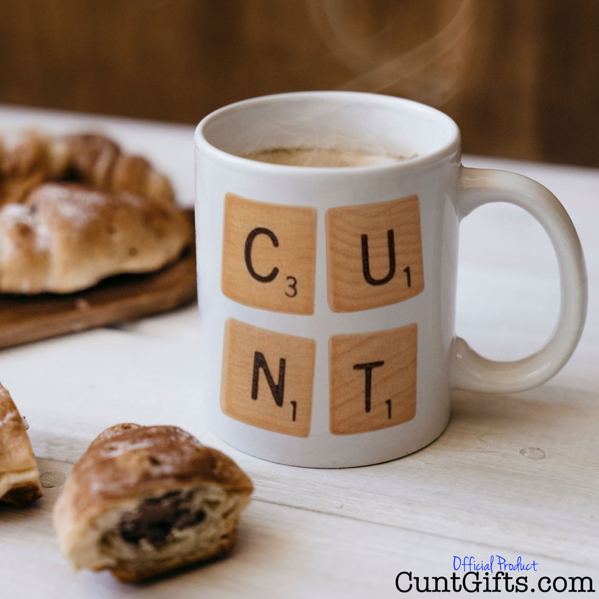 Scrabble Cunt Mug with coffee and pastries