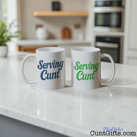 Two 'Serving Cunt'  mugs with text on a kitchen counter