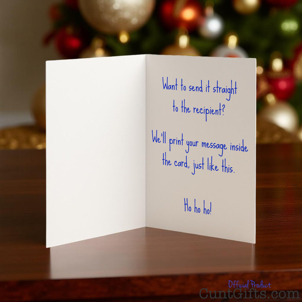 Christmas cunt card opened showing a personalised festive message inside with blue writing.