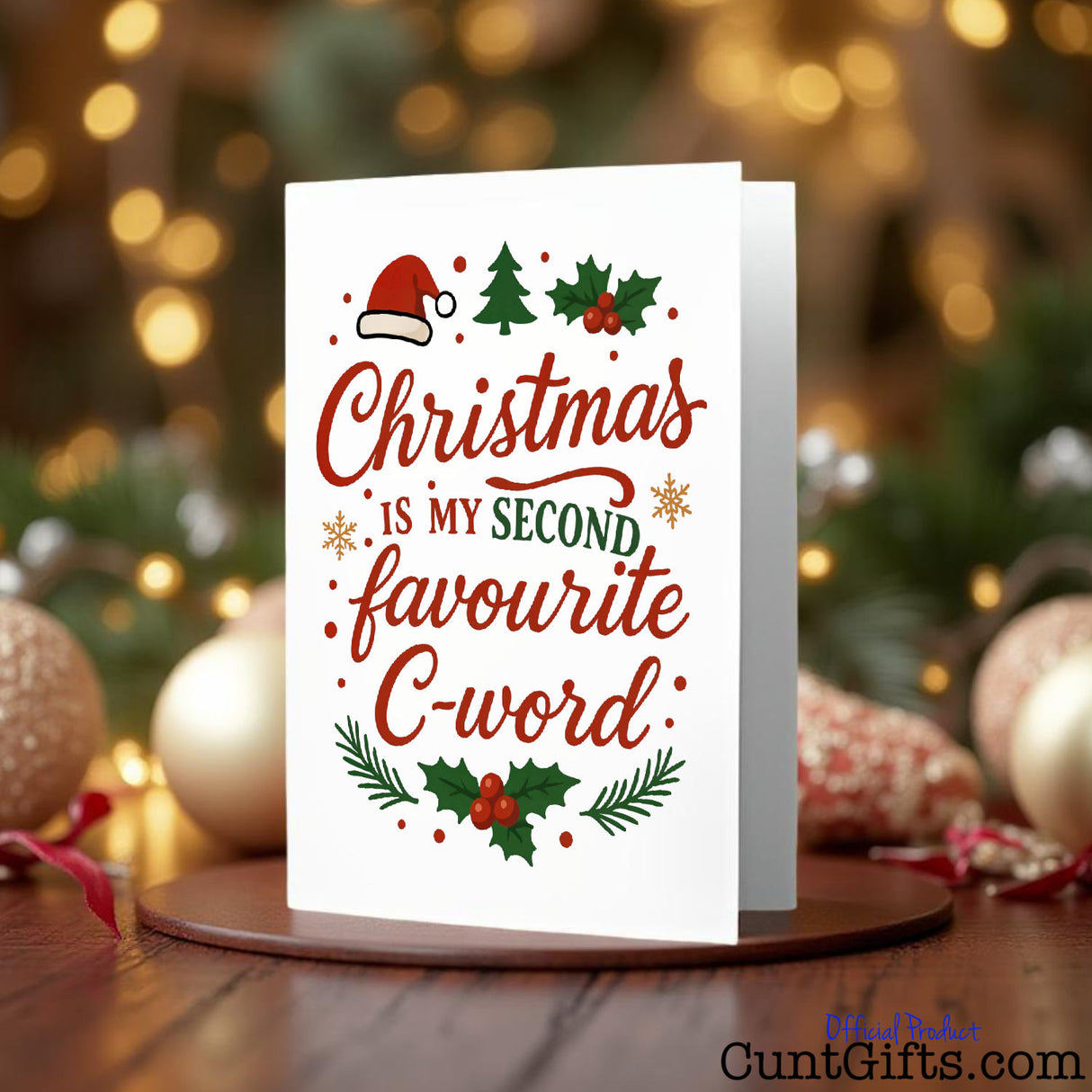 “Christmas is my second favourite C-word.” cunt Christmas Card and fairy lights on wooden table.