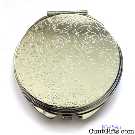 Classy Cunt compact mirror showing a floral design on the reverse side