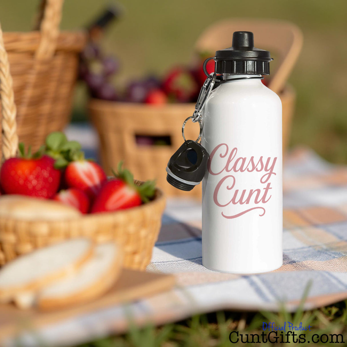 White water bottle with 'Classy Cunt' text on a picnic setting