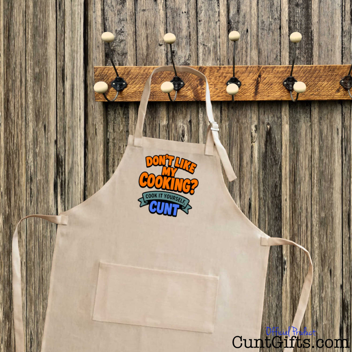 Don't like my cooking? Cook it yourself cunt apron on hook with wooden background