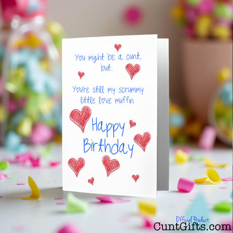 Scrummy Little Love Muffin cunt birthday card on a table with confetti