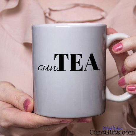 cuntTea Mug held by woman in pink blouse