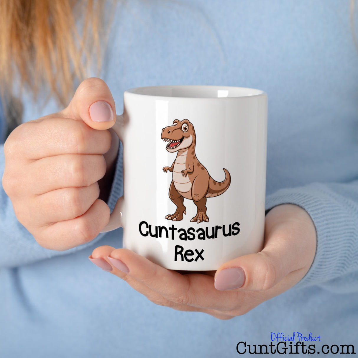 Cuntasaurus Rex Mug held by woman in blue sweater