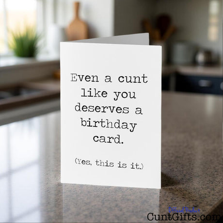Even a cunt like you birthday card on a kitchen counter