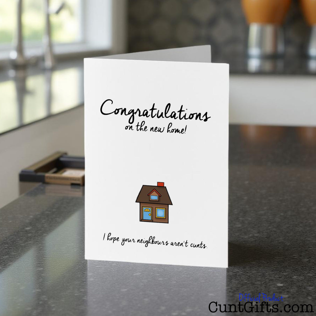 Congratulations on the new home greeting cunt card on a kitchen counter
