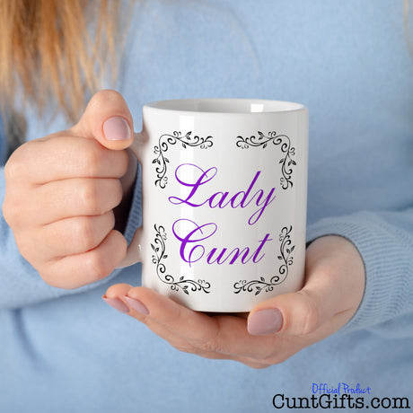 Lady cunt mug held by woman in blue jumper