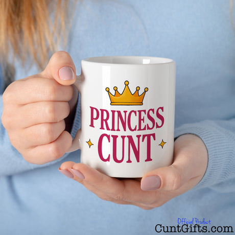 Princess Cunt Mug held by woman in blue top
