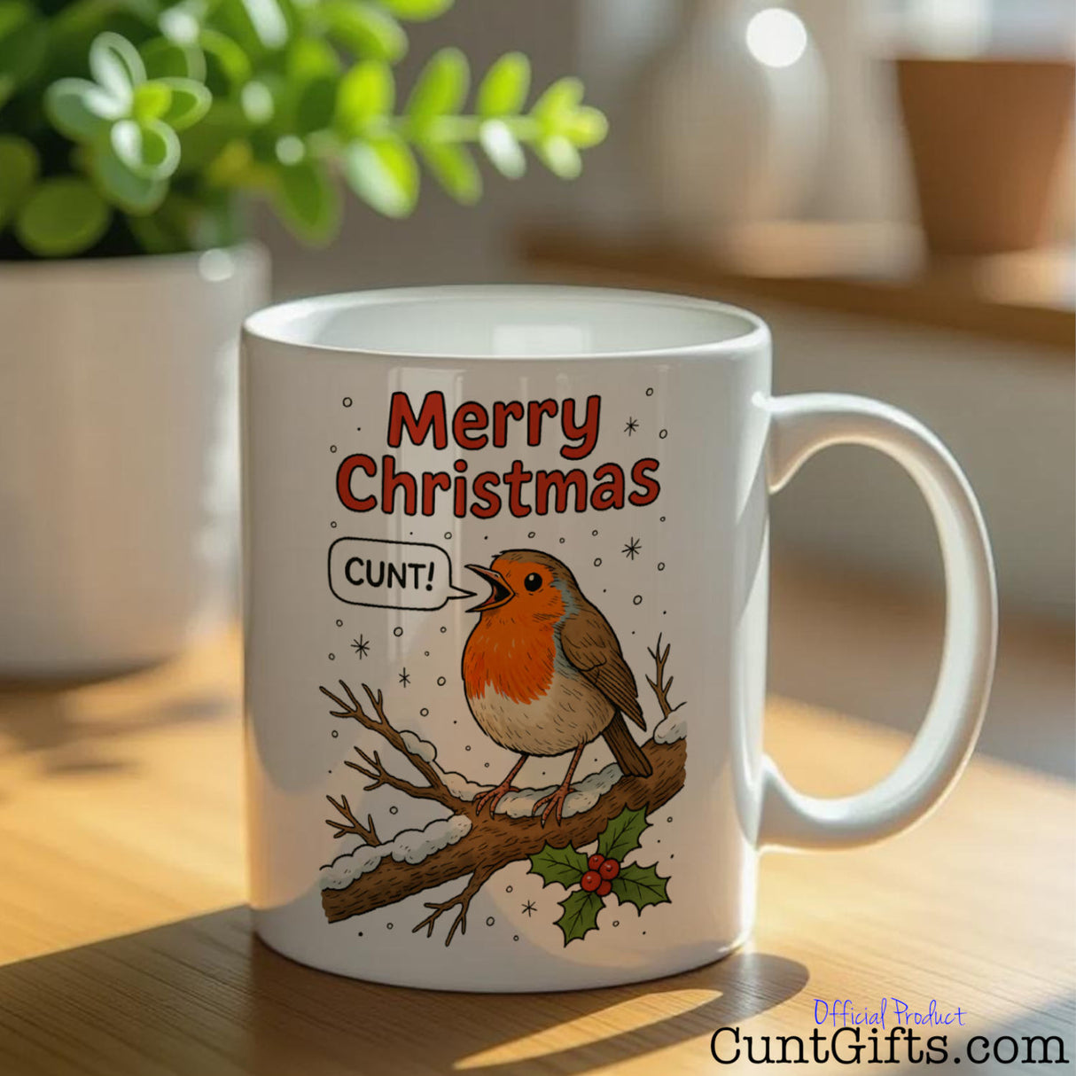 "Merry Christmas Cunt" Mug featuring a robin on table with plant pot.
