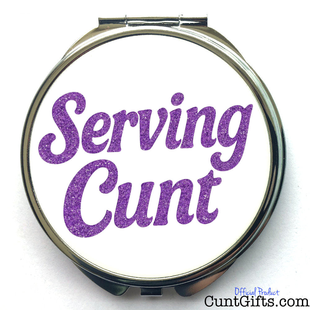 Compact mirror with purple text 'Serving Cunt' on a white background