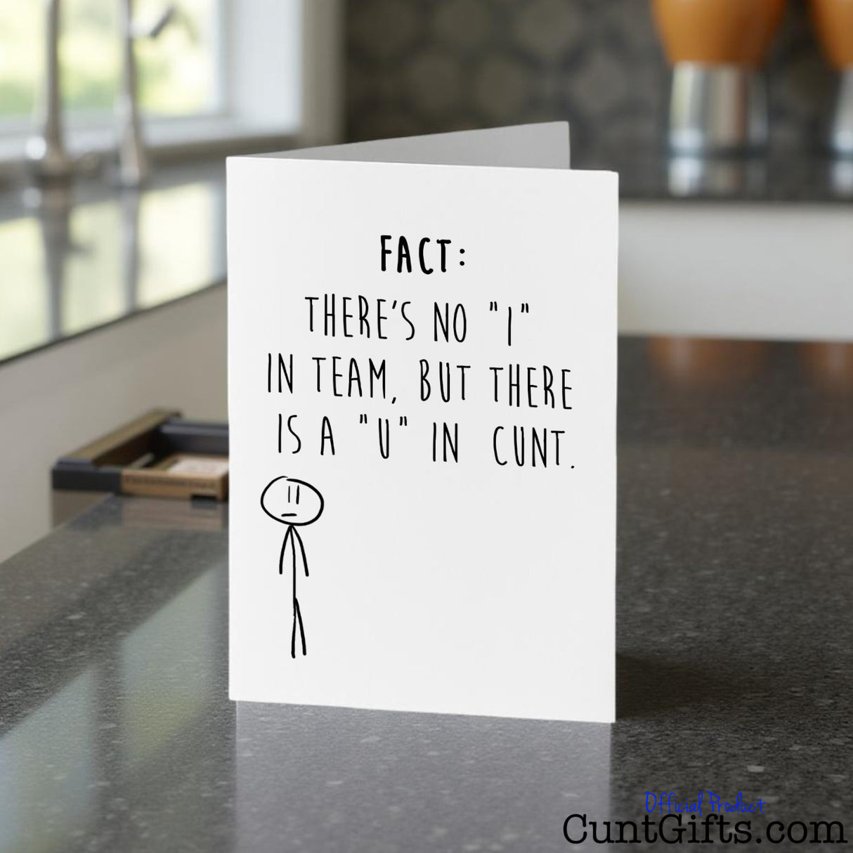 There's no "I" in team but there is a "u" in cunt Card on a kitchen counter