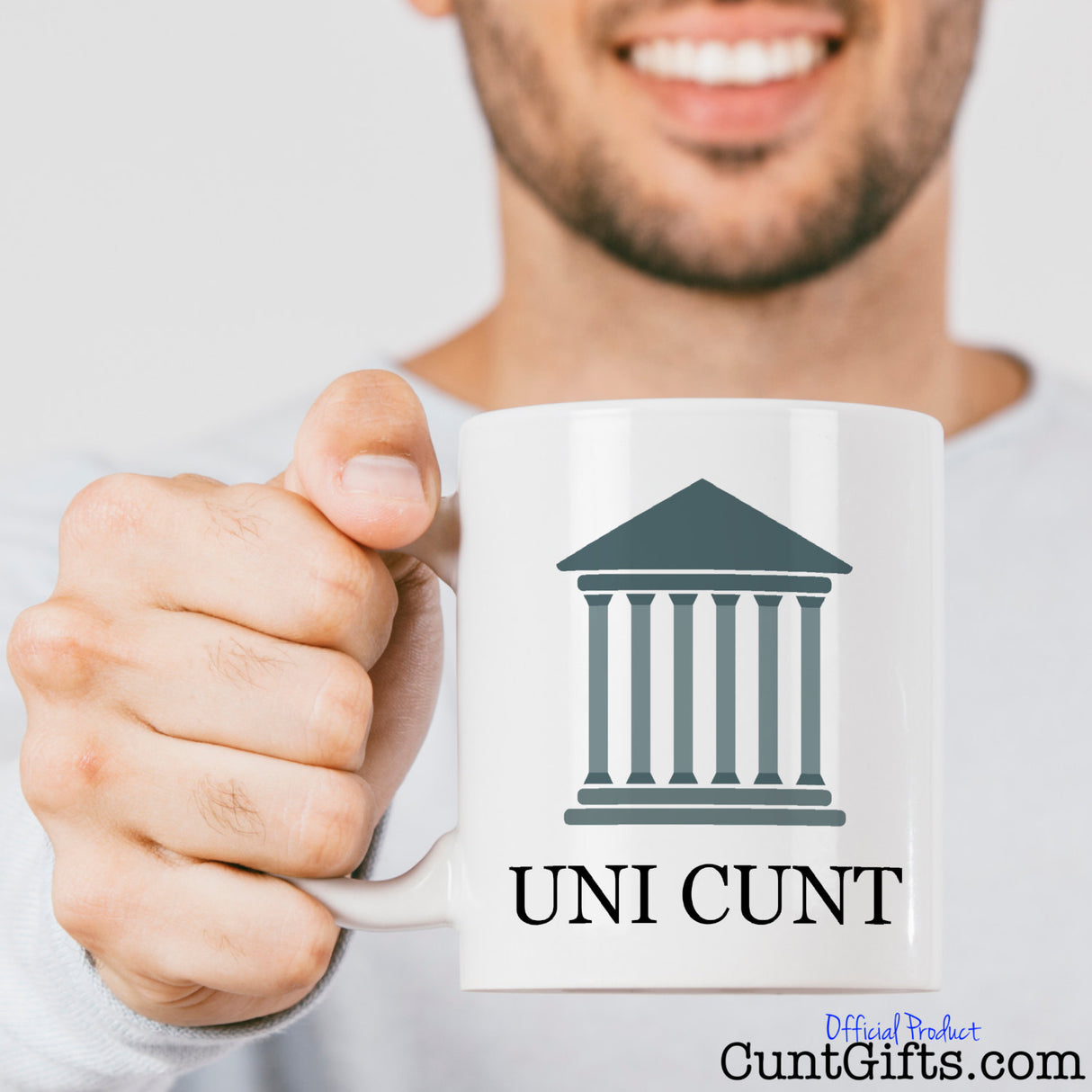 Smiling man with beard holding Uni Cunt Mug