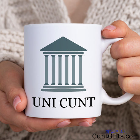Uni Cunt Mug held by woman in knitted cardigan