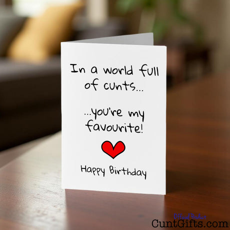 In a World Full of Cunts You're My Favourite Birthday card on a wooden surface