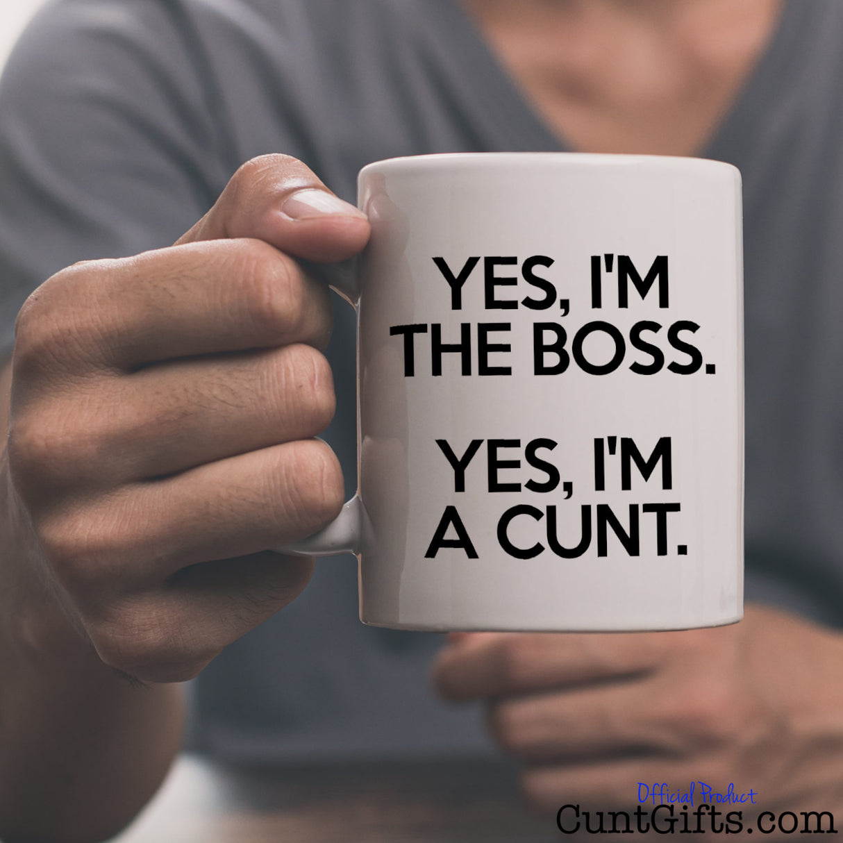 Yes, I’m the Boss. Yes, I’m a Cunt. - Mug held by man in grey tee shirt