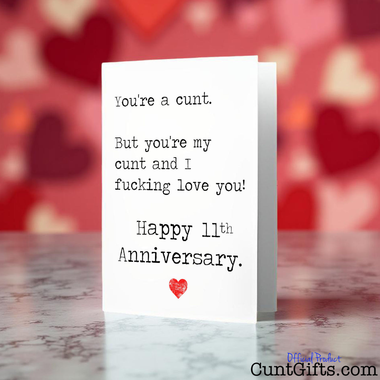 You're my cunt and I fucking love you anniversary Card on a marble surface with a heart-themed background