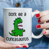 Don't be a Cuntasaurus - Mug held by woman in denim