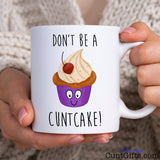 Don't be a Cuntcake - Mug held by woman in knitted jumper