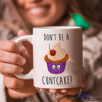 Don't be a Cuntcake - Mug held with a smile