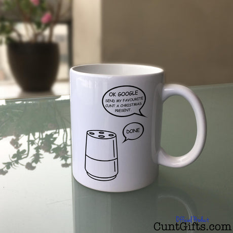 Google Cunt Christmas Mug on Glass Table