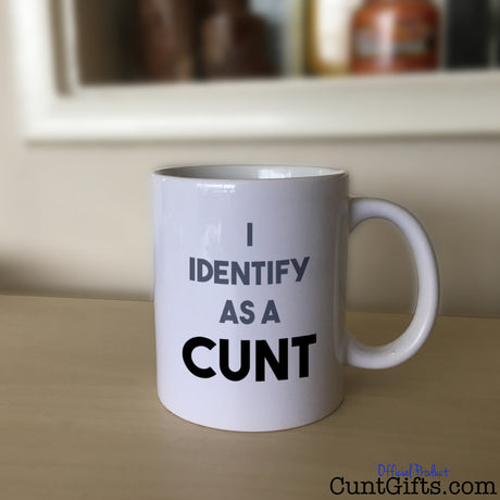 I Identify as a cunt mug on sideboard