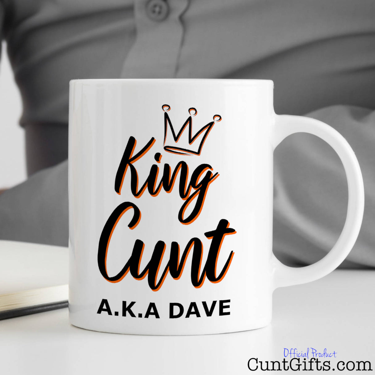 King Cunt Mug on desk with man writing