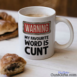 Warning my favourite word is cunt - Mug with coffee and pastries