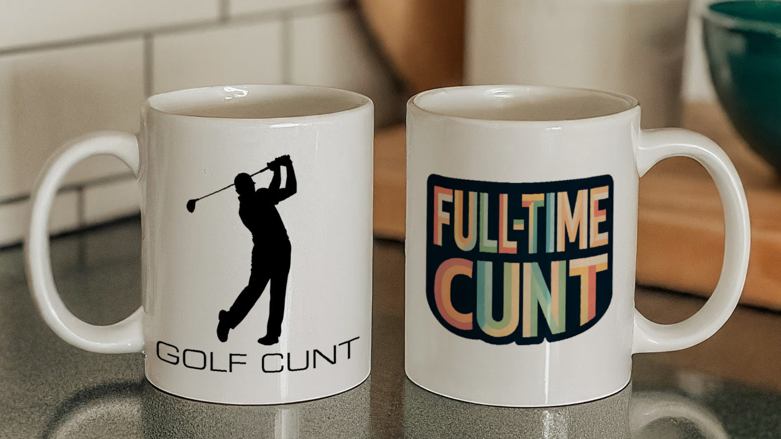 Golf Cunt Mug next to a Full-Time Cunt Mug on kitchen counter