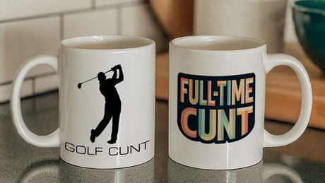 Golf Cunt Mug next to a Full-Time Cunt Mug on kitchen counter