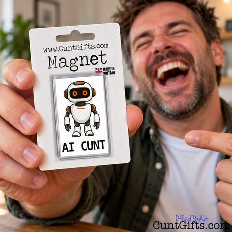 Laughing man holding up a funny AI Cunt fridge magnet in its branded packaging.