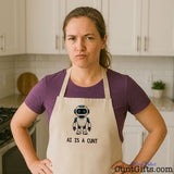 Woman wearing a rude AI Is a Cunt novelty apron with a cartoon robot design in a modern kitchen.
