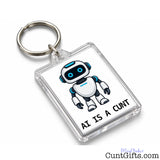 Transparent rectangular AI Is a Cunt keyring with metal split ring, featuring a blue-eyed robot and bold black lettering.