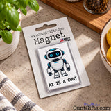 AI Is a Cunt fridge magnet in branded packaging displayed on a kitchen surface beside a striped tea towel.