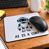 AI Is a Cunt mouse mat featuring a blue-eyed robot design with a black computer mouse, notebook and coffee mug on a wooden desk.