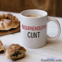 Bournemouth Cunt Mug with coffee and croissants