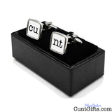 Cunt Cufflinks - CU and NT white design in presentation gift box at angle. 