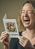 C is for Christmas and also for cunt - Card Design held by laughing woman