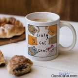 Crazy Cat Cunt Mug with pastries and coffee