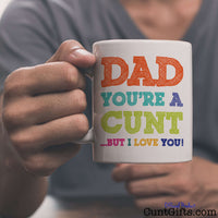Dad You're A Cunt But I Love You Mug - held by man in grey v-neck tee