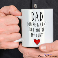 Dad Your a Cunt But Your My Cunt - Mug held by man in black shirt